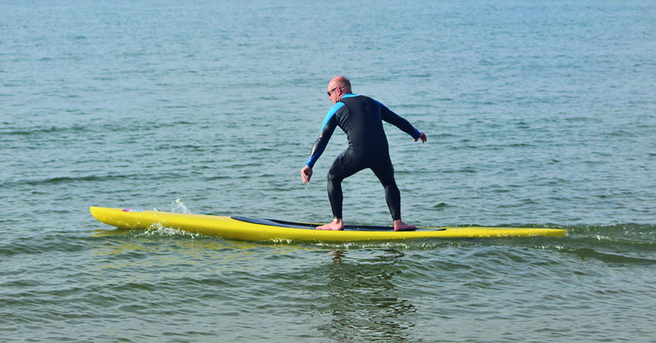 Prone paddling by Tez Plavenieks